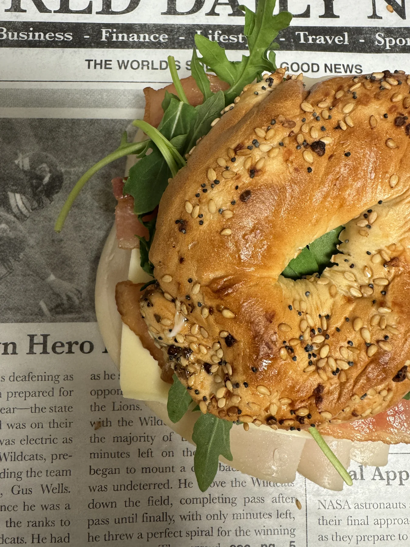 Bagel sandwich held in hand