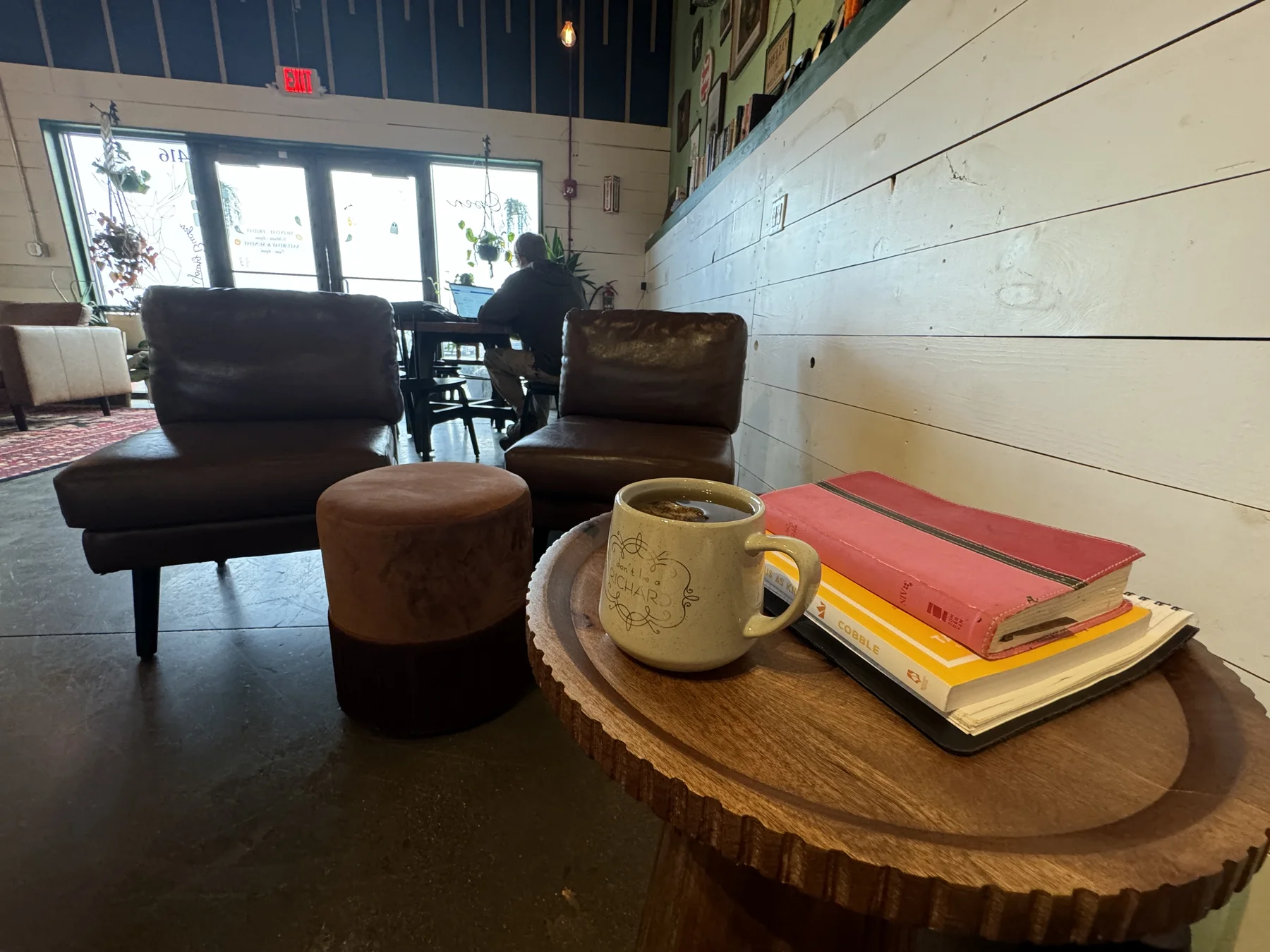 Coffee mug and books in a cozy seating corner